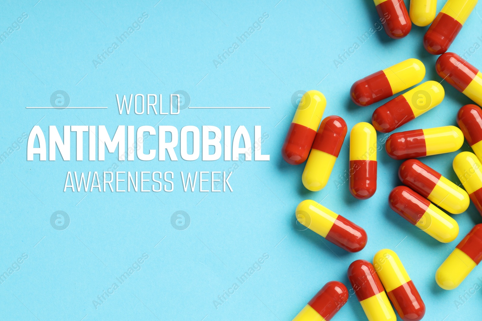World antibiotic awareness week. Many pills on light blue background, flat lay Image of World antibiotic awareness week. Many pills on light blue background, flat lay