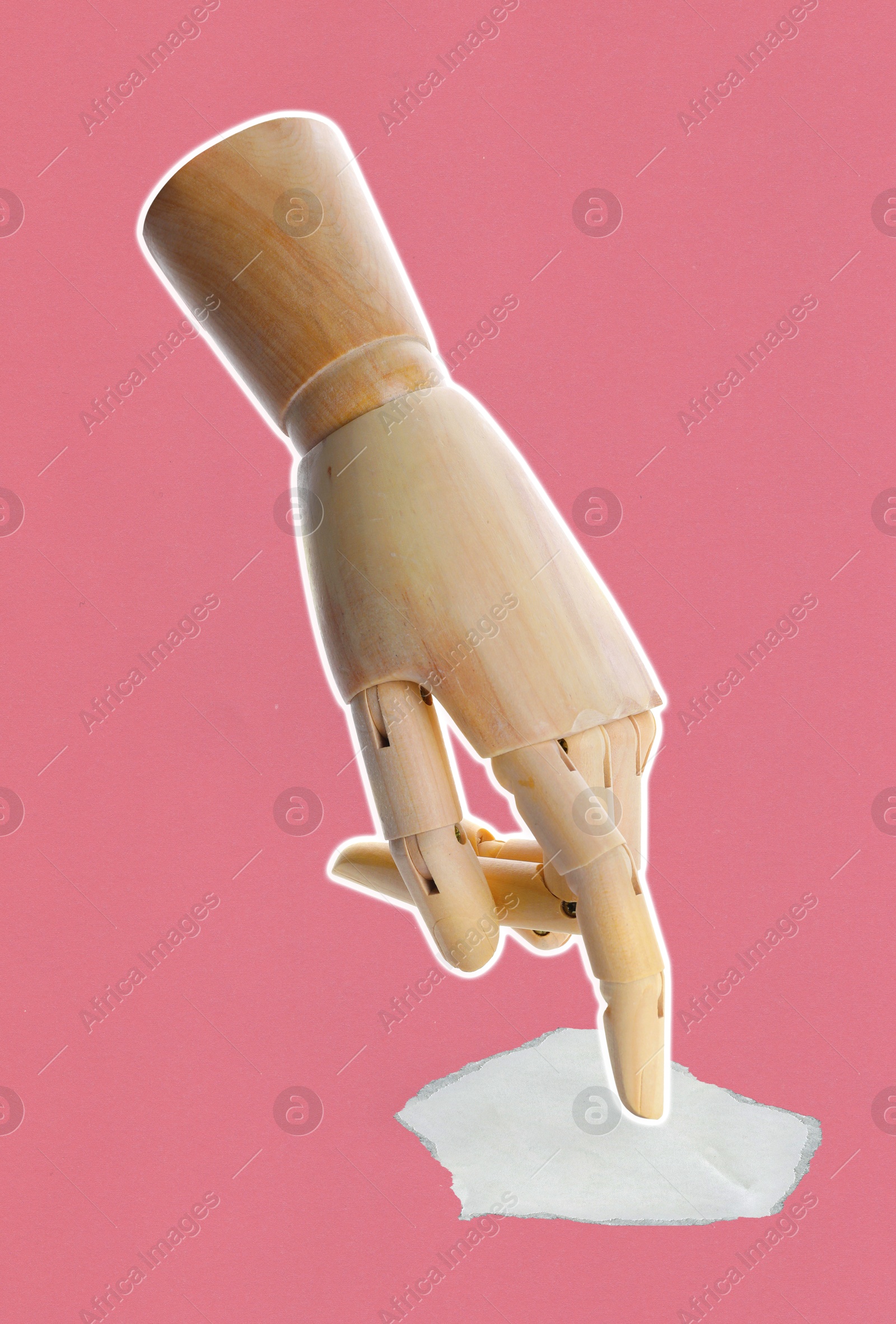 Wooden hand pointing at piece of paper on pink background Image of Wooden hand pointing at piece of paper on pink background
