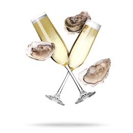 Image of Sparkling wine in glasses and fresh oysters falling on white background