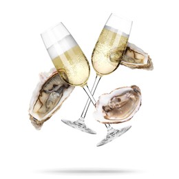 Image of Sparkling wine in glasses and fresh oysters falling on white background