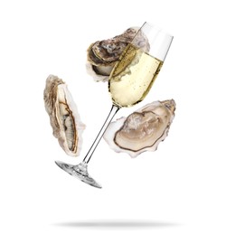 Image of Sparkling wine in glass and fresh oysters falling on white background