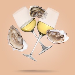 Image of White wine in glasses and fresh oysters falling on beige background