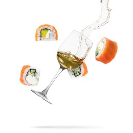 Image of Wine in glass and sushi rolls falling on white background