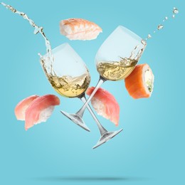 Image of Wine in glasses and sushi falling on light blue background