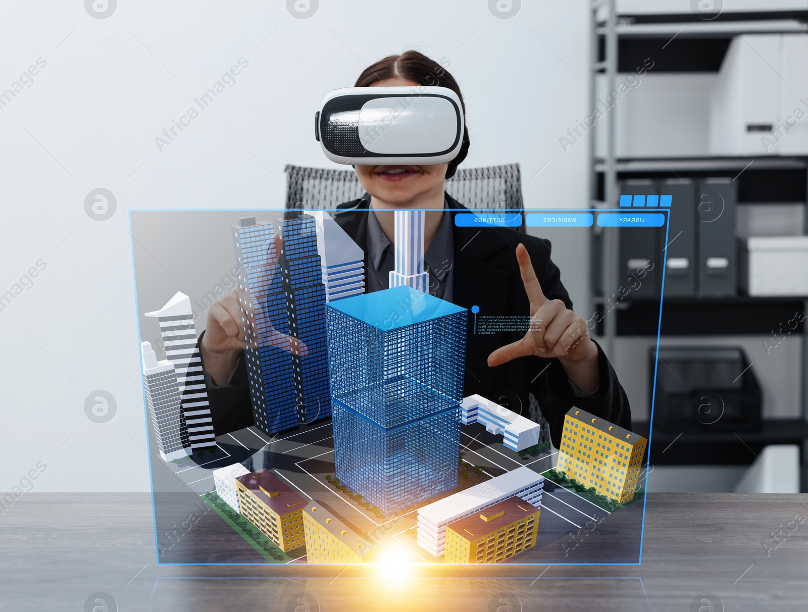 Image of Building information modelling. Woman using virtual reality headset in office. Holographic screen with cityscape