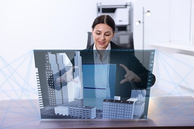 Image of Building information modelling. Woman using virtual screen in office