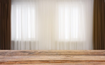 Image of Empty wooden table against windows with curtains in room, banner design