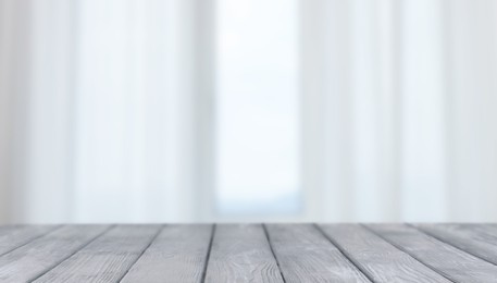 Image of Empty wooden table against window with curtains in room, banner design