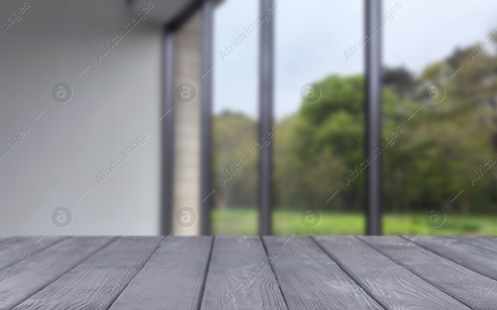 Empty wooden table against window in room Image of Empty wooden table against window in room
