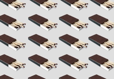 Image of Cardboard box with matches on light grey background, pattern design