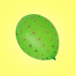Image of Green balloon covered with cactus prickles on yellow background