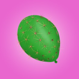 Image of Green balloon covered with cactus prickles on magenta color background