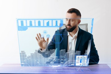 Image of Building information modelling. Man using virtual screen in office