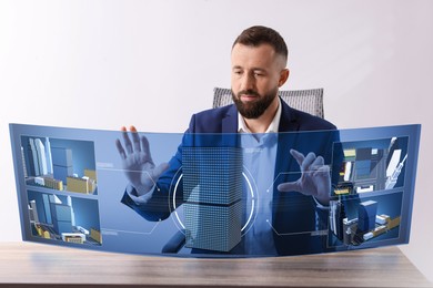 Image of Building information modelling. Man using virtual screen in office