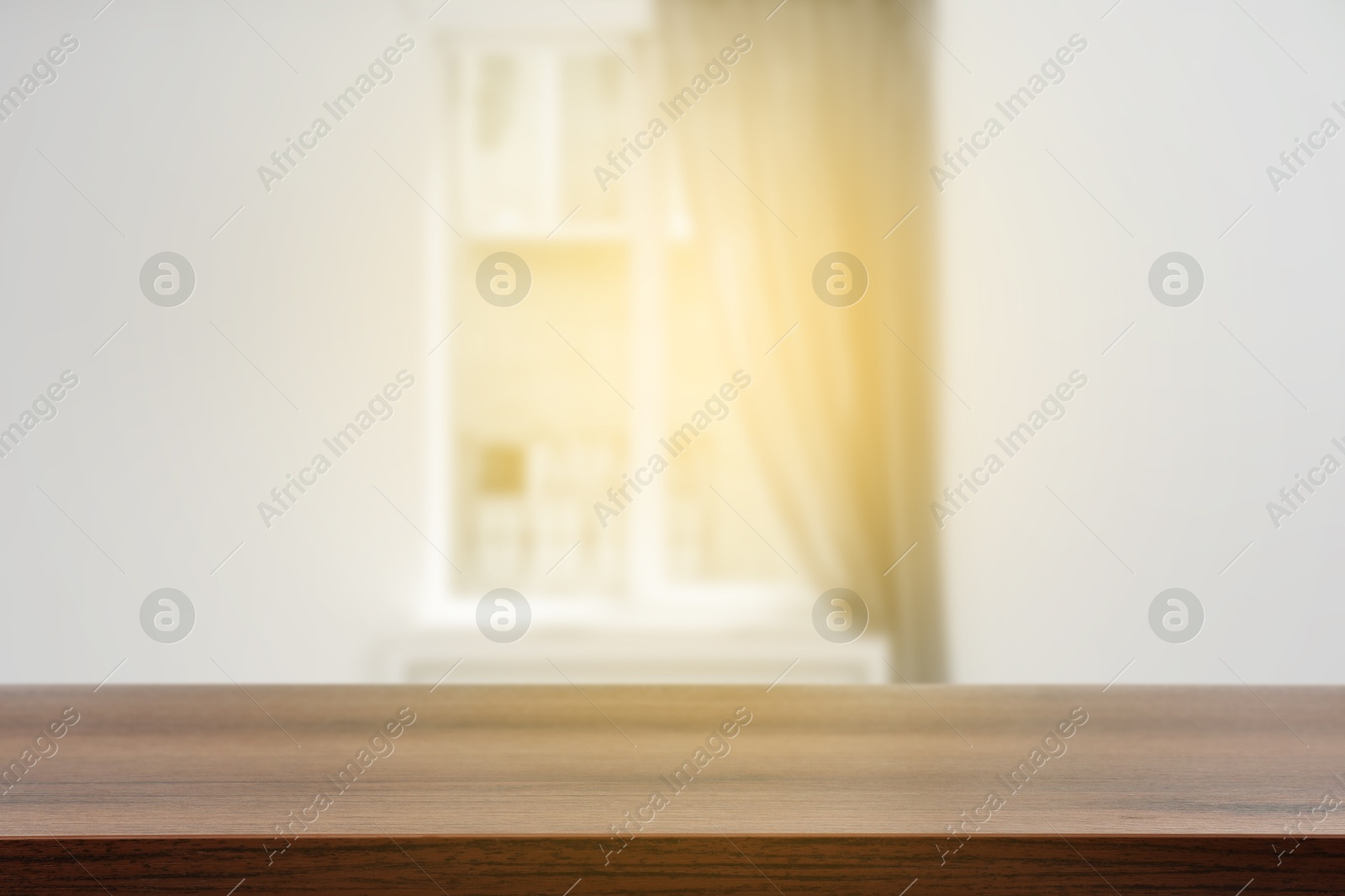 Image of Empty wooden table against window with curtain in room