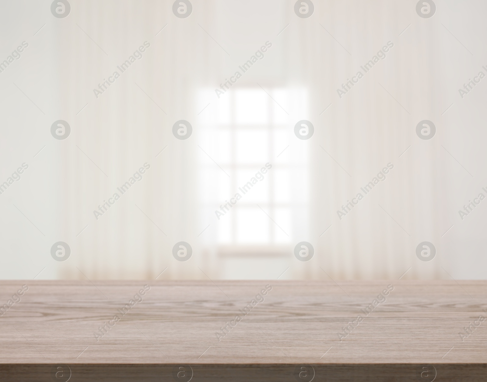 Empty wooden table against window with curtains in room Image of Empty wooden table against window with curtains in room