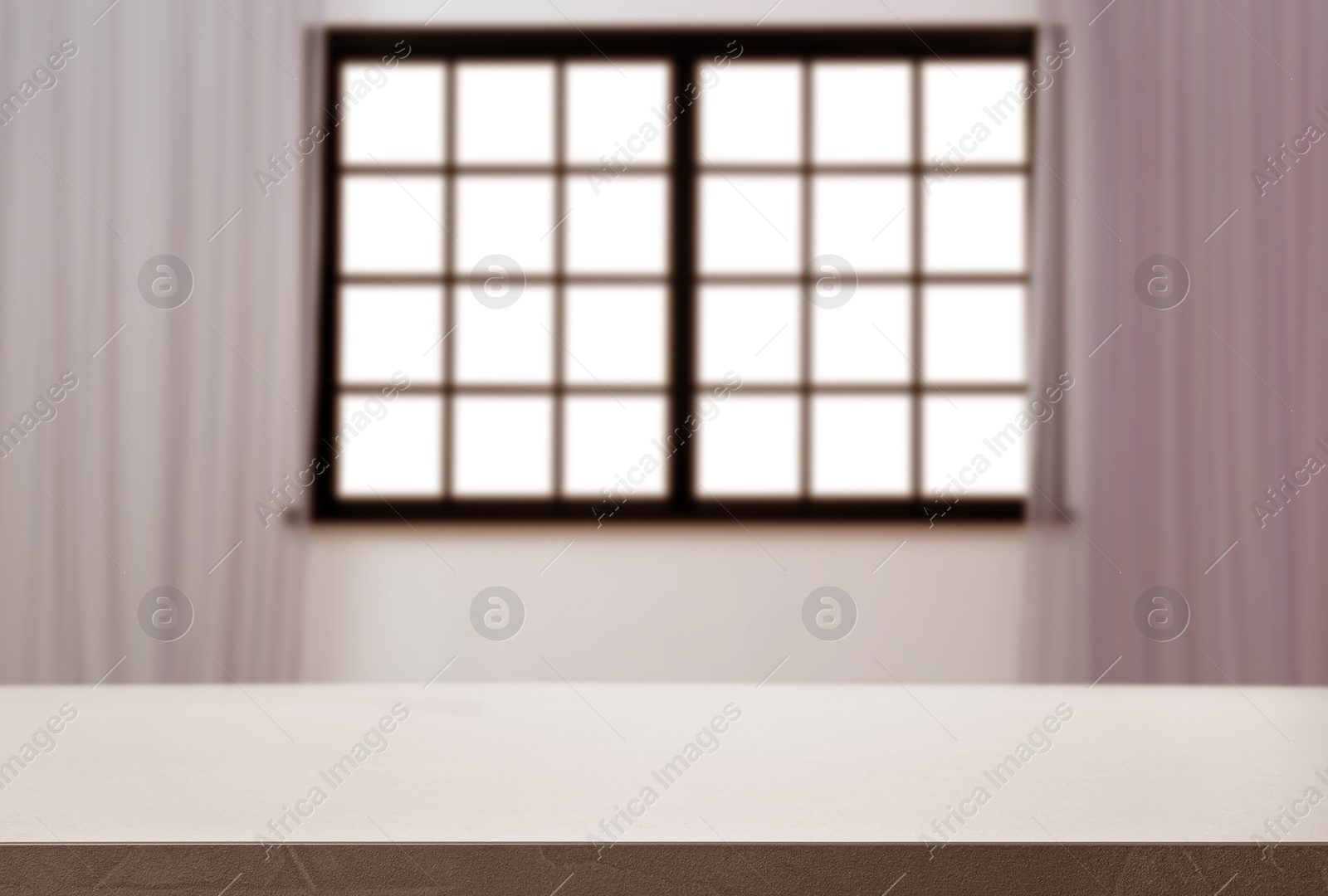 Image of Empty table against window with curtains in room