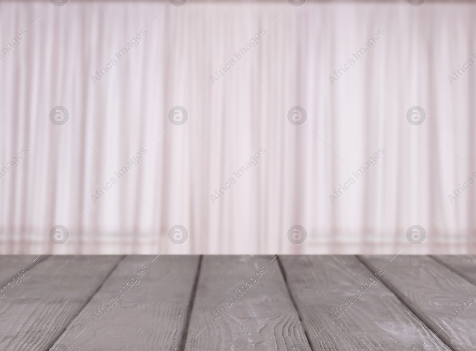 Empty wooden table against window with curtains in room Image of Empty wooden table against window with curtains in room