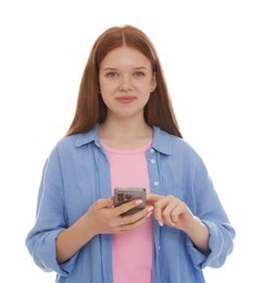Photo of Beautiful teenage girl using smartphone on white background