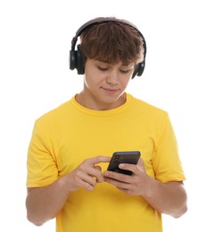 Photo of Teenage boy in headphones using smartphone on white background