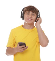 Photo of Smiling teenage boy in headphones with smartphone on white background