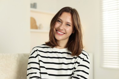 Photo of Portrait of smiling teenage girl at home