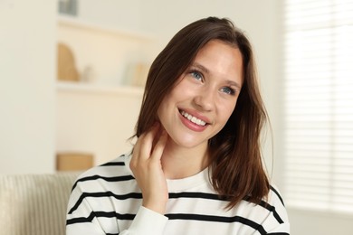 Photo of Portrait of smiling teenage girl at home