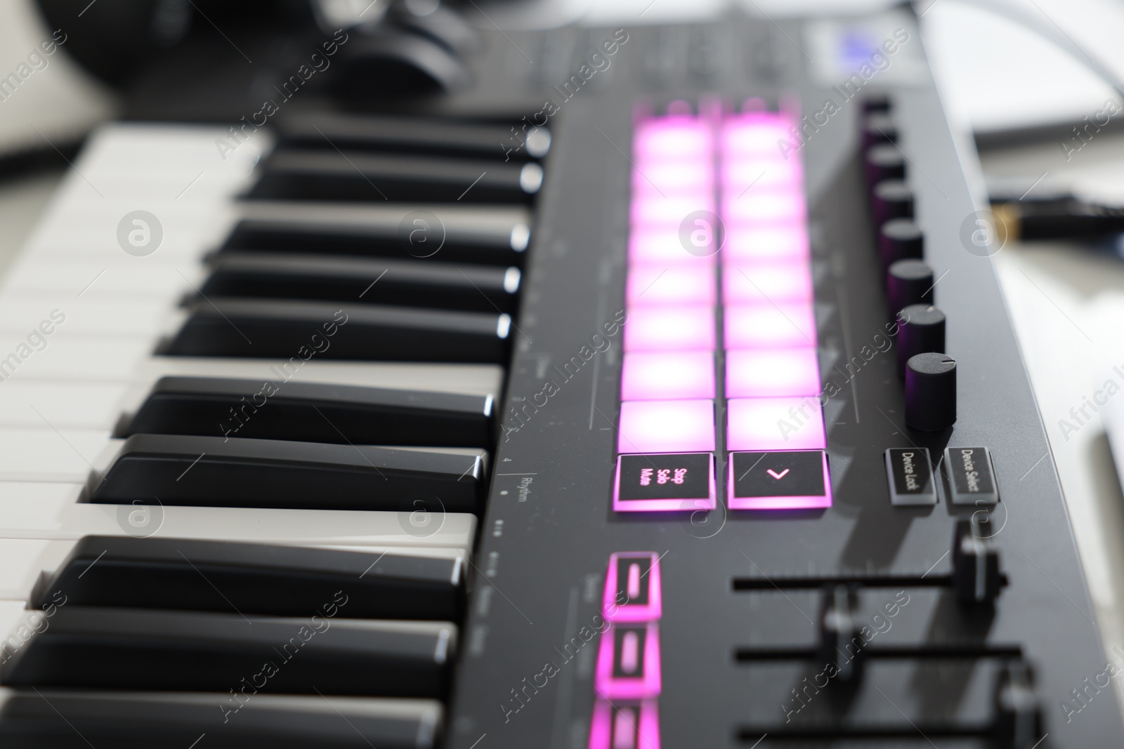 Photo of One portable MIDI keyboard on table, closeup