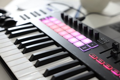 Photo of One portable MIDI keyboard on table, closeup