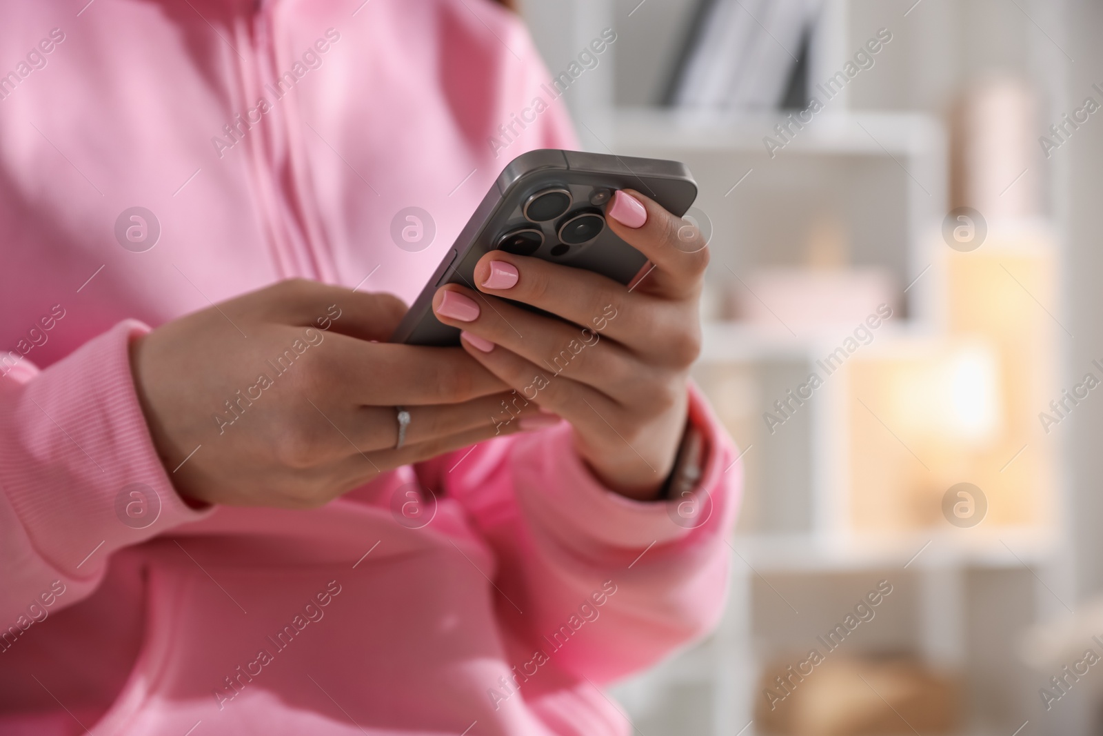Teenage girl with smartphone at home, closeup Photo of Teenage girl with smartphone at home, closeup