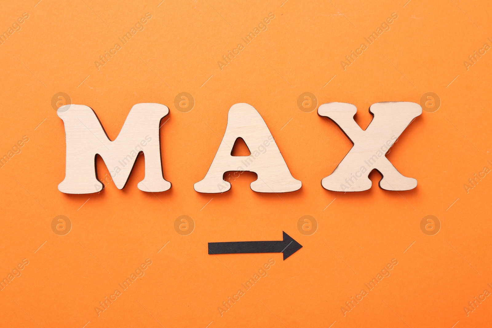 Word Max made of wooden letters and arrow on orange background, flat lay Photo of Word Max made of wooden letters and arrow on orange background, flat lay