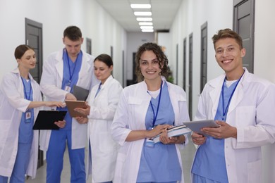 Photo of Group of medical students in uniforms indoors