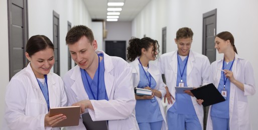 Photo of Group of medical students in uniforms indoors