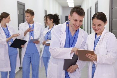 Photo of Group of medical students in uniforms indoors