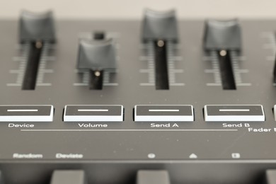 Photo of One portable MIDI keyboard with faders, closeup