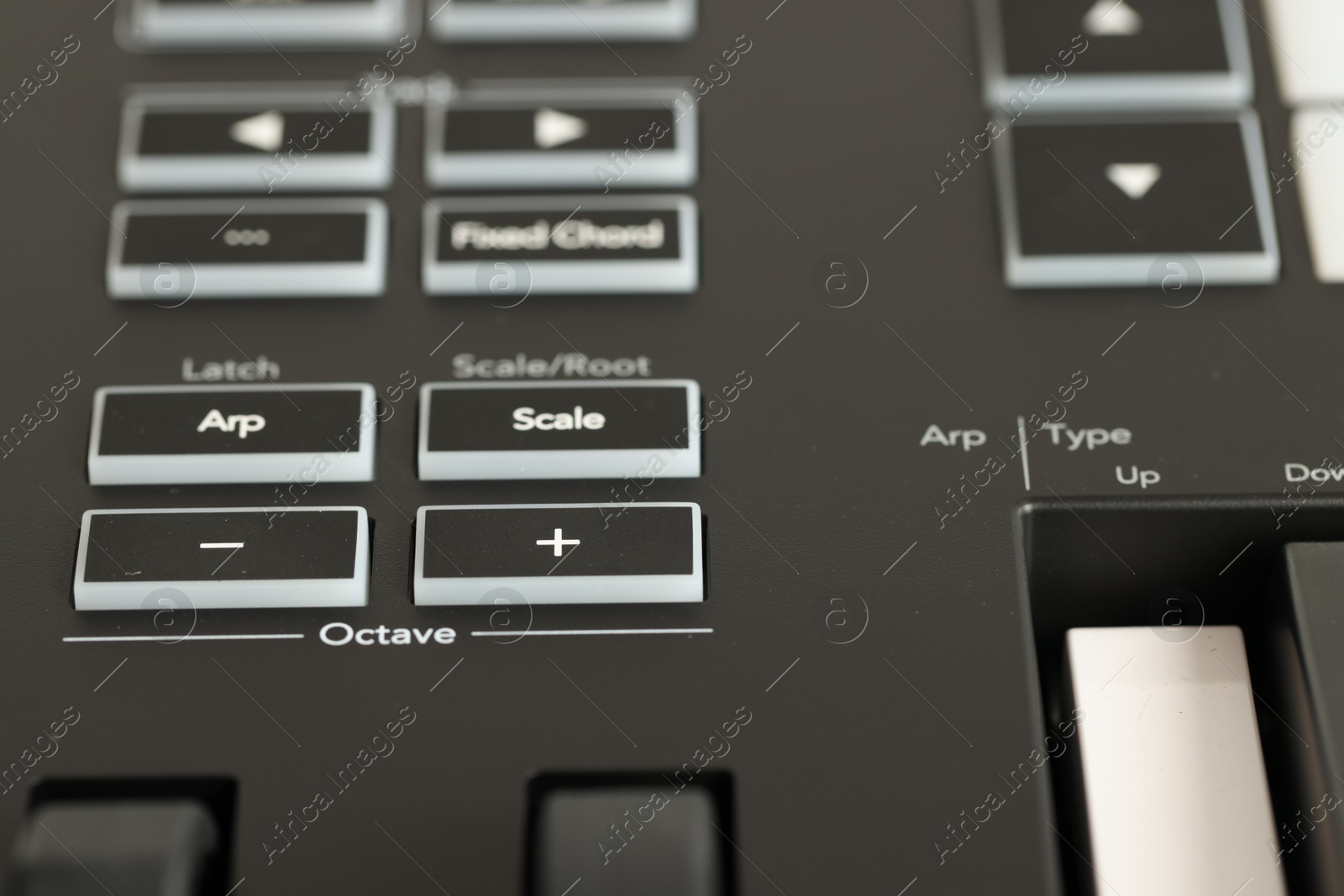 One portable MIDI keyboard with buttons, closeup Photo of One portable MIDI keyboard with buttons, closeup
