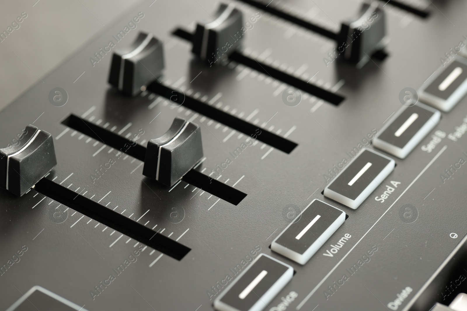 One portable MIDI keyboard with faders, closeup Photo of One portable MIDI keyboard with faders, closeup