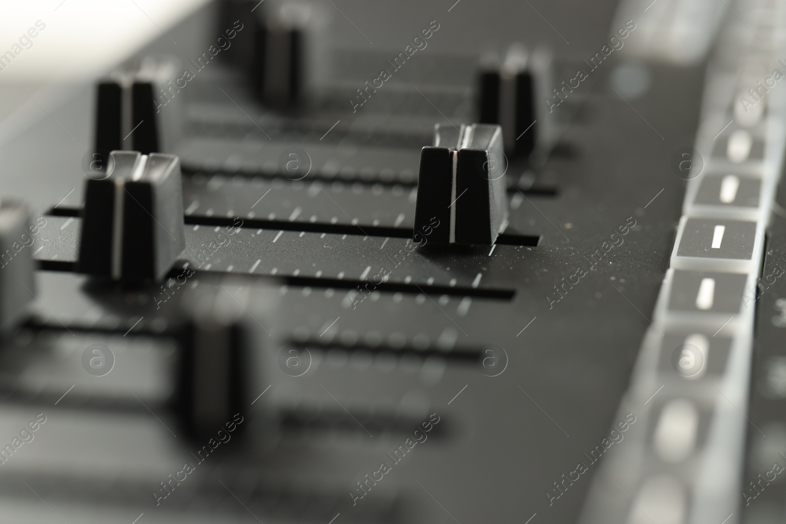 One portable MIDI keyboard with faders, closeup Photo of One portable MIDI keyboard with faders, closeup