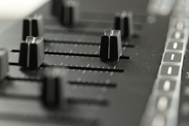 Photo of One portable MIDI keyboard with faders, closeup