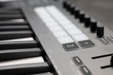 Photo of One portable MIDI keyboard on table, closeup