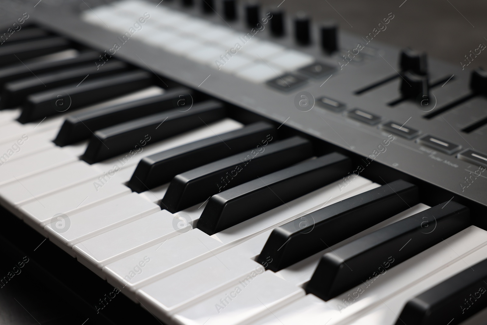Photo of One portable MIDI keyboard on table, closeup