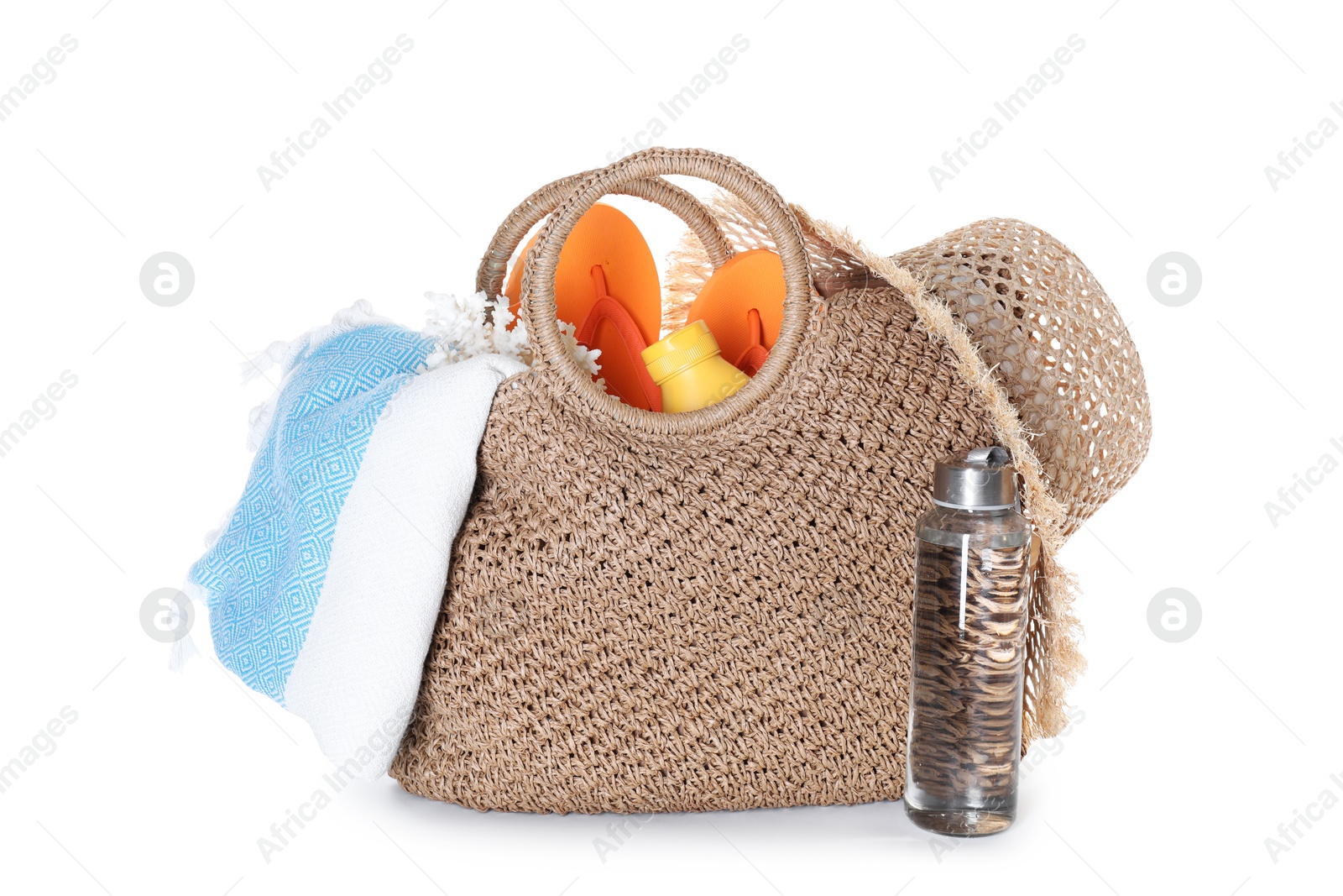 Stylish bag with beach accessories isolated on white Photo of Stylish bag with beach accessories isolated on white