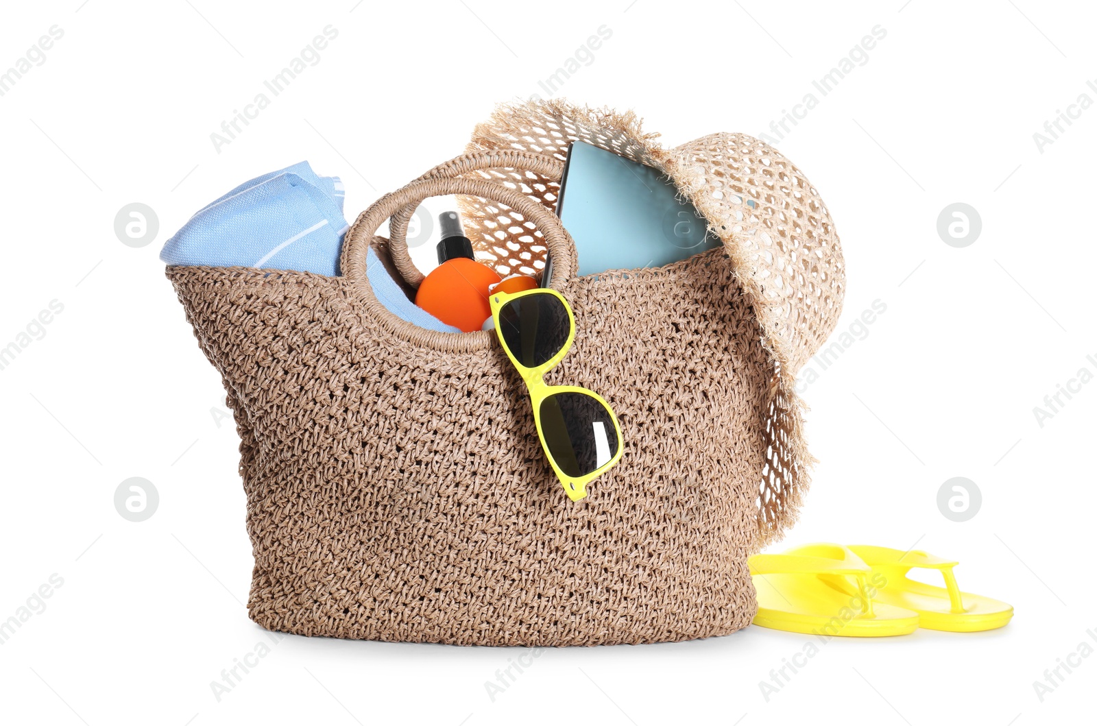 Stylish bag with beach accessories isolated on white Photo of Stylish bag with beach accessories isolated on white