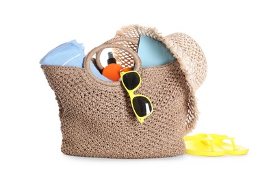 Photo of Stylish bag with beach accessories isolated on white