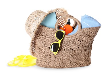 Photo of Stylish bag with beach accessories isolated on white