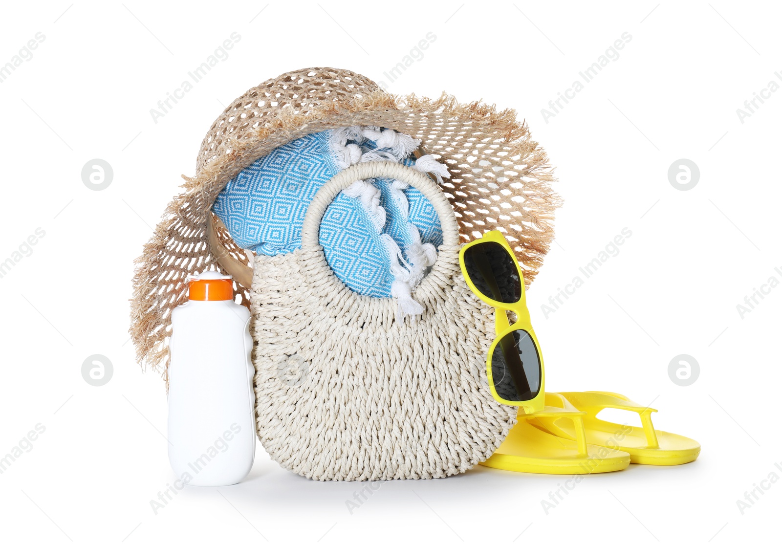 Stylish bag with beach accessories isolated on white Photo of Stylish bag with beach accessories isolated on white