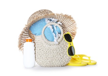 Photo of Stylish bag with beach accessories isolated on white