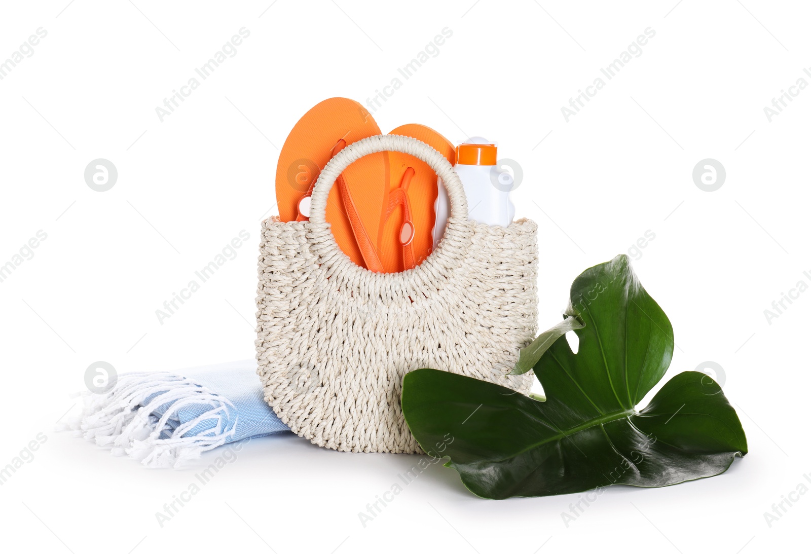 Stylish bag with beach accessories isolated on white Photo of Stylish bag with beach accessories isolated on white
