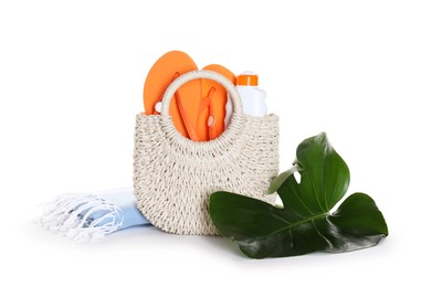 Photo of Stylish bag with beach accessories isolated on white