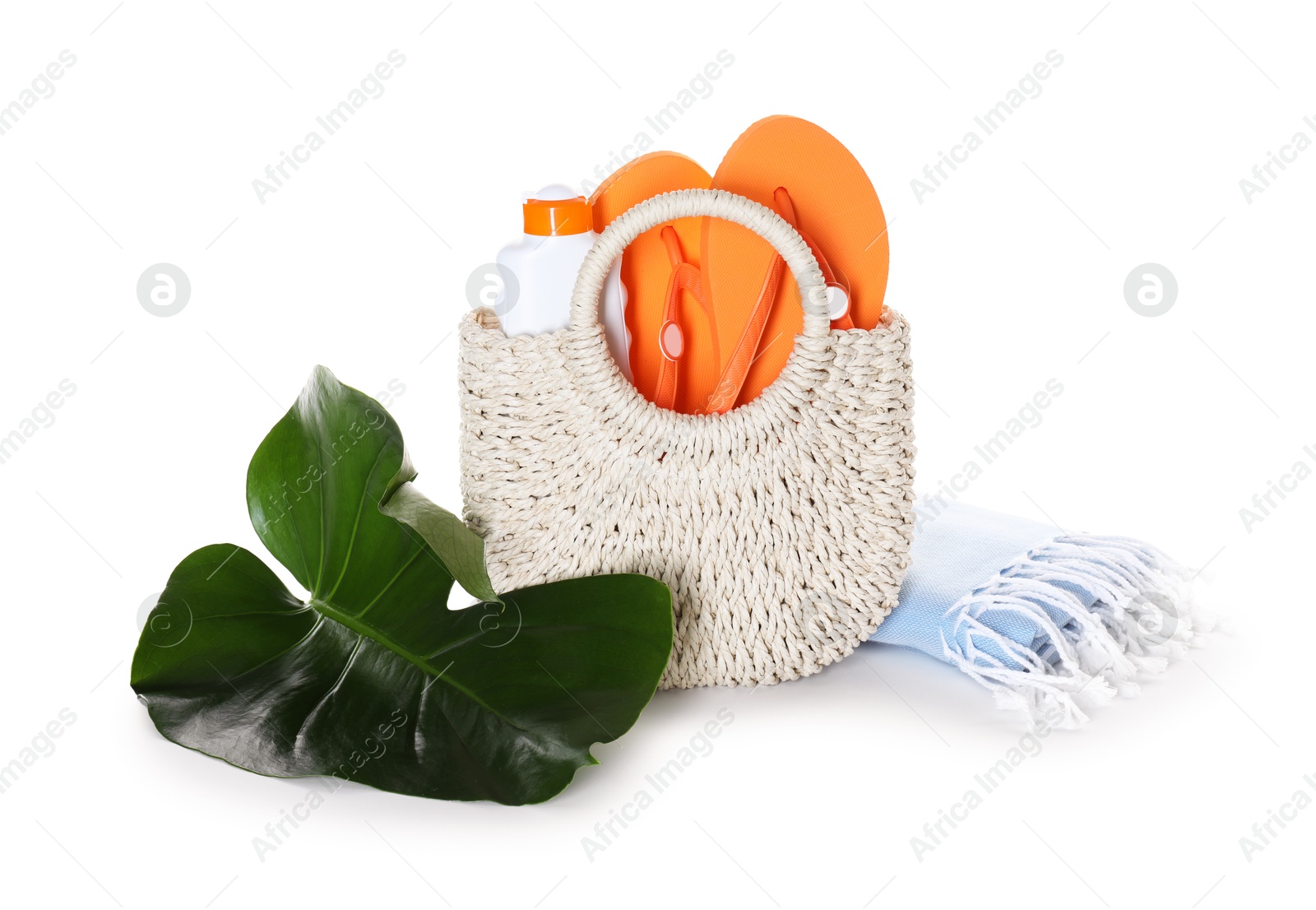 Stylish bag with beach accessories isolated on white Photo of Stylish bag with beach accessories isolated on white